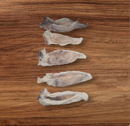 dehydrated raw rabbit ear dog treats. rabbit ears have fur on them to benefit dog's digestion